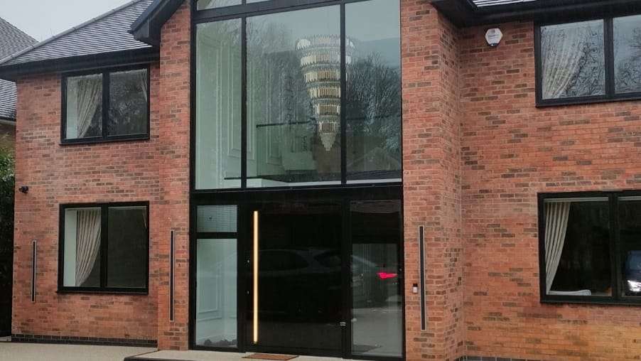 Double height glazed entrance, by Austral Glazing Ltd
